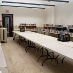 Tables waiting for picture books in the Community Room.